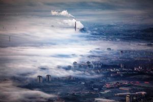 Foggy Sunrise view on the city from above